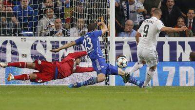Real Madrid's Karim Benzema scores to put Madrid ahead 3-2 in their Champions League match against Schalke on Tuesday at the Santiago Bernabeu. Daniel Ochoa de Olza / AP