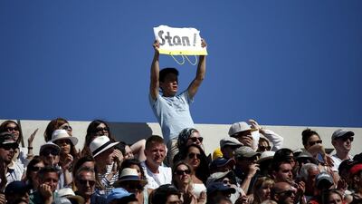 A fan of Stan Wawrinka of Switzerland hold a placard while watching him playing gainst Novak Djokovic of Serbia during the men’s final match for the French Open tennis tournament at Roland Garros in Paris, France, 07 June 2015. EPA/YOAN VALAT