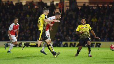 Arsenal’s Aaron Ramsey scores the team’s third goal on Saturday in their 3-0 win over Watford in the Premier League. Alan Walter / Action Images / Reuters