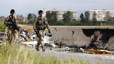 Waste management in Italy is so lucrative that even the organised crime group Camorra has taken over trash disposal contracts since the 1990s. Above, Italian army soldiers patrol a road near Acerra southern Italy. Alessandro Bianchi / Reuters