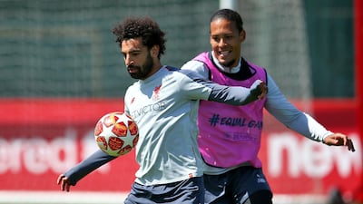 Liverpool's Mohamed Salah (left) and Virgil van Dijk during training. PA Wire.