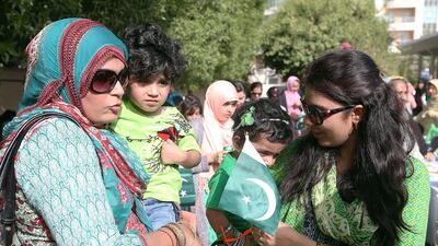 Pakistani families celebrate their independence day at the Pakistan Consulate in Dubai. Satish Kumar / The National