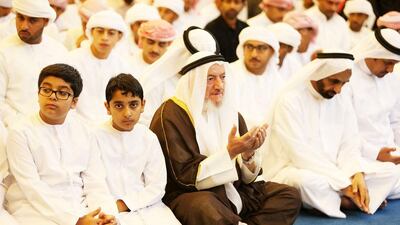 An elderly man prays at Zabeel Mosque in Dubai. Pawan Singh / The National