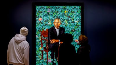 Visitors view the Smithsonian's National Portrait Gallery official portrait of Mr Obama by Kehinde Wiley at the High Museum of Art in Atlanta, Georgia. EPA