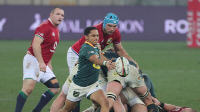 South Africa's Hershel Jantjies goes to kick the ball clear.