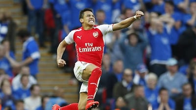 Arsenal’s Alexis Sanchez celebrates after scoring the game winner in extra time against Reading on Saturday night. John Sibley / Reuters