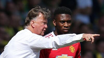 Louis van Gaal gives instructions to Manchester United substitue Timothy Fosu Mensah before he enters the pitch against Norwich City on May 7, 2016.