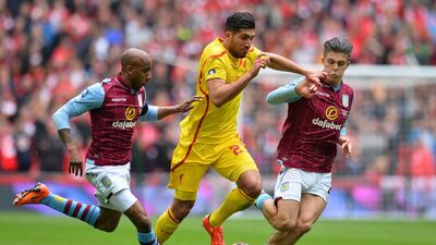 Aston Villa's Jack Grealish, right. tries to dispossess Liverpool's Emre Can on Sunday during the FA Cup semi-final at Wembley. Glyn Kirk / AFP