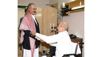 The Yemeni president, Ali Abdullah Saleh, visits the wounded deputy premier Rashad Al Alimi in the Saudi capital on Saturday. EPA