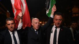 Tunisian President Kais Saied joins supporters in Tunis after the announcement of provisional election results, on October 6. AFP