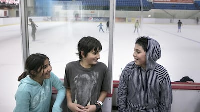 Maya Noueihed, 10, her brother Maher Noueihed, 12, centre, and their friend Arsalaan Khan, 11, hang out as they join a group of home-schooled children at one of their regular, recreational get-togethers. Silvia Razgova / The National