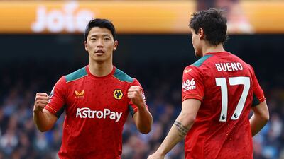 Wolverhampton Wanderers' Hwang Hee-chan celebrates scoring their first goal with Hugo Bueno. Reuters
