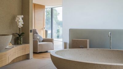 As well as the rough-hewn stone used on walls and staircases, the materials used are of high quality, such as natural oak and white porphyry Italian stone. Courtesy Savills and TK International