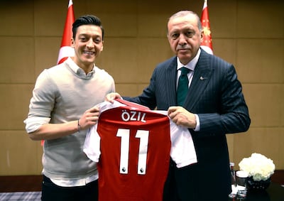 Mesut Ozil poses for the controversial photograph with Turkish President Recep Tayyip Erdogan last year. AP