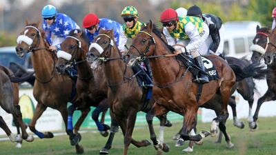 Rabbah De Carrere, right, ridden by Royston Ffrench and trained by Majed Al Jahouri, wins the President of the UAE Cup at the Abu Dhabi Equestrian Club in Abu Dhabi on February 16, 2014. Sammy Dallal / The National