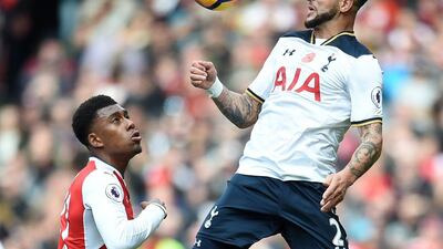 Tottenham's Kyle Walker, right, vies for the ball with Arsenal's Alex Iwobi. Andy Rain / EPA