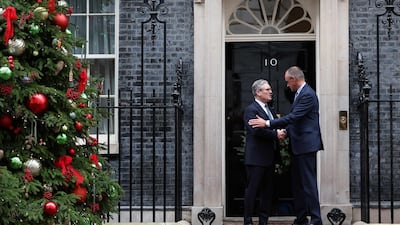 Mr Starmer greets Mr Merz on his arrival at Number 10. AFP