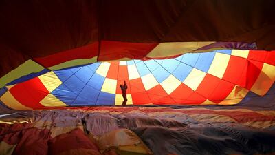 A man prepares a hot air balloon during the 2nd Hot Air Balloon Carnival in Nanjing, Jiangsu province, China. Reuters