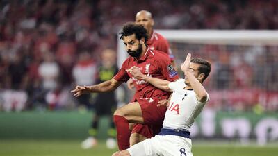 Mohamed Salah rides a challenge from Tottenham's Harry Winks in the 2019 final. Getty