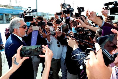 Abdullah Abdullah, Chairman of the High Council for National Reconciliation, talks with the media at Kabul International Airport in Kabul, Afghanistan, Friday, Sept. 11, 2020. Officials on both sides of Afghanistan's protracted conflict say efforts are ramping up for the start of intra-Afghan negotiations, a critical next step to a U.S. negotiated peace deal with the Taliban. (Sapidar Palace via AP)