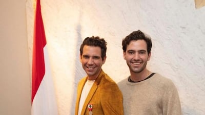 L-R: Lebanese-French singer Mika holds the Lebanese National Order of Merit: Silver Palm with his brother Fortune. The artist received the distinction for his I Love Beirut concert held to raise funds for Beirut Port explosion recovery effort. Instagram.com/mikainstagram