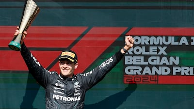 Mercedes driver George Russell celebrates on the podium after winning the Belgian Grand Prix at the Spa-Francorchamps racetrack on Sunday, July 28, 2024. The British driver was later disqualified after race officials discovered his Mercedes car was underweight. AP