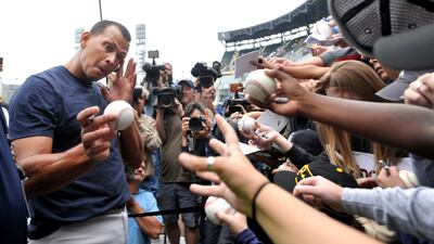 The youngest man to hit 500 home runs found a few fans still asking for autographs before the game. He obliged. Paul Beaty / AP Photo