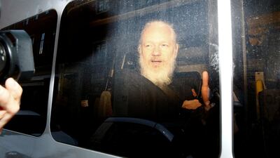 WikiLeaks founder Julian Assange is seen in a police van, after he was arrested in London, Henry Nicholls / Reuters