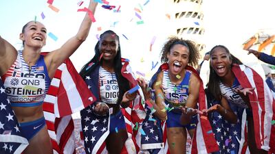 EUGENE, OREGON - JULY 24: Gold medalists Abby Steiner, Talitha Diggs, Sydney McLaughlin, and Britton Wilson of Team United States celebrate after competing in the Women's 4x400m Relay Final on day ten of the World Athletics Championships Oregon22 at Hayward Field on July 24, 2022 in Eugene, Oregon. Patrick Smith / Getty Images / AFP
