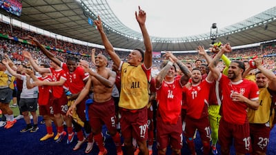 Switzerland's players celebrate with the fans after their Euro 2024 round of 16 win over Italy in Berlin on Saturday, June 29, 2024. AFP