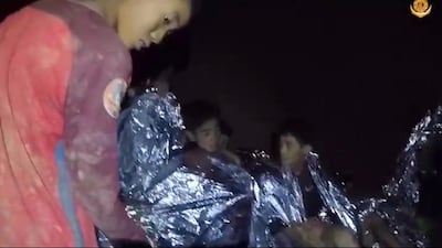 Some of the members of a trapped football team in a section of Tham Luang cave in Khun Nam Nang Non Forest Park, Chiang Rai province, Thailand. Royal Thai Navy / EPA