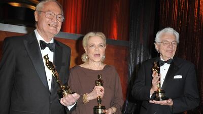 Lauren Bacall, producer-director Roger Corman and cinematographer Roger Willis with their awards at the Academy of Motion Picture Arts and Sciences inaugural Governors Awards at the Grand Ballroom at Hollywood & Highland Center in Hollywood, California. AFP