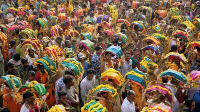 Tamil Hindu worshippers take part in a procession during the Panguni Uthiram festival, in Ahmedabad, India. AP
