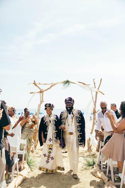 Traditional Eritrean wedding attire complete with zuria and kabas. Courtesy Farida Design