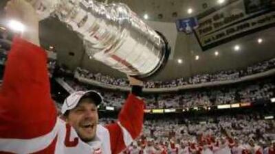 Detroit Red Wings; Nicklas Lidstrom, of Sweden, lifts the Stanley Cup.
