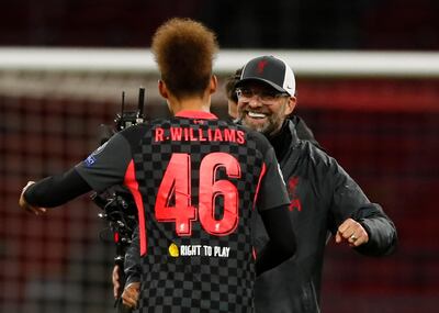 Liverpool's manager Jurgen Klopp, right, of Germany embraces Liverpool's Rhys Williams as they celebrate their victory following the group D Champions League soccer match between Ajax and Liverpool at the Johan Cruyff ArenA in Amsterdam, Netherlands, Wednesday, Oct. 21, 2020. Liverpool won the match 1-0. AP Photo