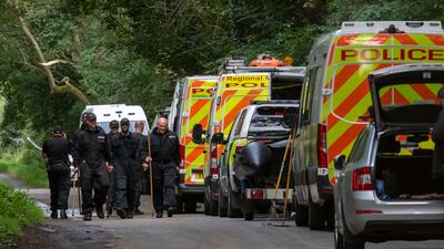 Police officers searching the land at Sand Hutton Gravel Pits near York. AP Photo