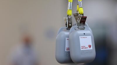 TraceTogether tokens are being distributed to residents at Jalan Besar Community Club, as the government speeds up contact tracing efforts to curb the spread of the Covid-19 in Singapore. Reuters