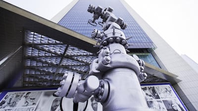 An oil pipeline control head sits on display outside the entrance to the Abu Dhabi National Oil Company (Adnoc) headquarters in Abu Dhabi. Photographer: Christopher Pike/Bloomberg