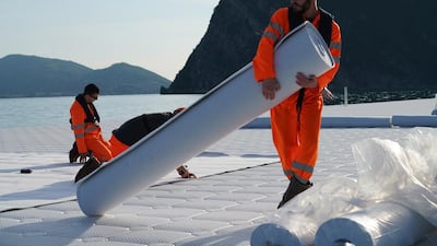 Workers install the felt that will cover the floating cubes before the yellow fabric is installed, May 2016 Photo: Wolfgang Volz