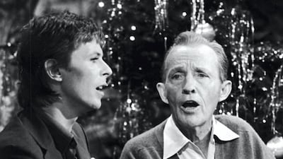 British rock singer and actor David Bowie performs with American pop singer Bing Crosby for the TV special, 'Bing Crosby's Merrie Olde Christmas.' Getty