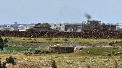 An Israeli army tank and bulldozer at the Abu Diab military post on the southern outskirts of the Syrian border town of Quneitra. AFP