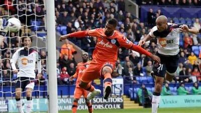 Bolton’s Darren Pratley, right, scores the opening goal in the match against Queens Park Rangers. The home side went on to win 2-1.