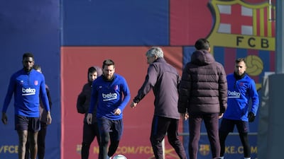 Barcelona manager Quique Setien attends a training session with Samuel Umtiti, Lionel Messi (2L) and Jordi Alba. AFP