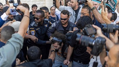 Police scuffle with left-wing Israeli protesters to make way for the far-right National Security Minister, Itamar Ben-Gvir, outside the Supreme Court in Jerusalem. AFP