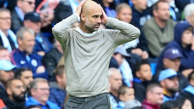 Manchester City's Spanish manager Pep Guardiola reacts during the English Premier League football match between Manchester City and Wolverhampton Wanderers at the Etihad Stadium in Manchester, north west England, on October 6, 2019. RESTRICTED TO EDITORIAL USE. No use with unauthorized audio, video, data, fixture lists, club/league logos or 'live' services. Online in-match use limited to 120 images. An additional 40 images may be used in extra time. No video emulation. Social media in-match use limited to 120 images. An additional 40 images may be used in extra time. No use in betting publications, games or single club/league/player publications. / AFP / Lindsey Parnaby / RESTRICTED TO EDITORIAL USE. No use with unauthorized audio, video, data, fixture lists, club/league logos or 'live' services. Online in-match use limited to 120 images. An additional 40 images may be used in extra time. No video emulation. Social media in-match use limited to 120 images. An additional 40 images may be used in extra time. No use in betting publications, games or single club/league/player publications.