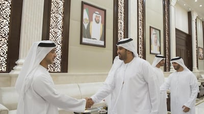 Sheikh Mansour bin Zayed, Deputy Prime Minister and Minister of Presidential Affairs, left, with members of Al Jazira Football Club during an iftar reception at Al Bateen Palace. Mohamed Al Hammadi / Crown Prince Court - Abu Dhabi
