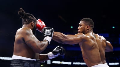Anthony Joshua punches Jermaine Franklin during the Heavyweight fight between Anthony Joshua and Jermaine Franklin at The O2 Arena. G0etty Images