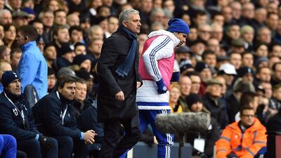 Chelsea's Diego Costa, right, passes manager Jose Mourinho as he goes to warm up during the English Premier League football match between Tottenham Hotspur and Chelsea at White Hart Lane in north London on November 29, 2015. AFP PHOTO / BEN STANSALL