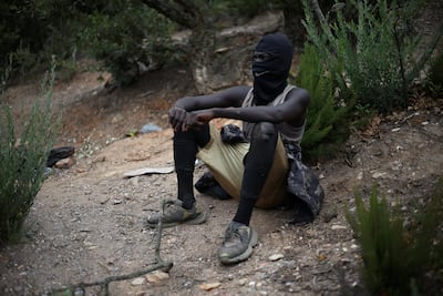 A Sudanese migrant who has been living in the mountains of Bni Salah for almost a year and has made three attempts to cross into Spain. Reuters